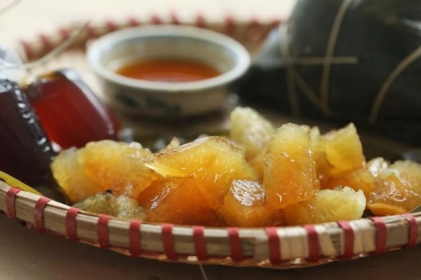 Golden, translucent Tro Cake served with sweet cane syrup