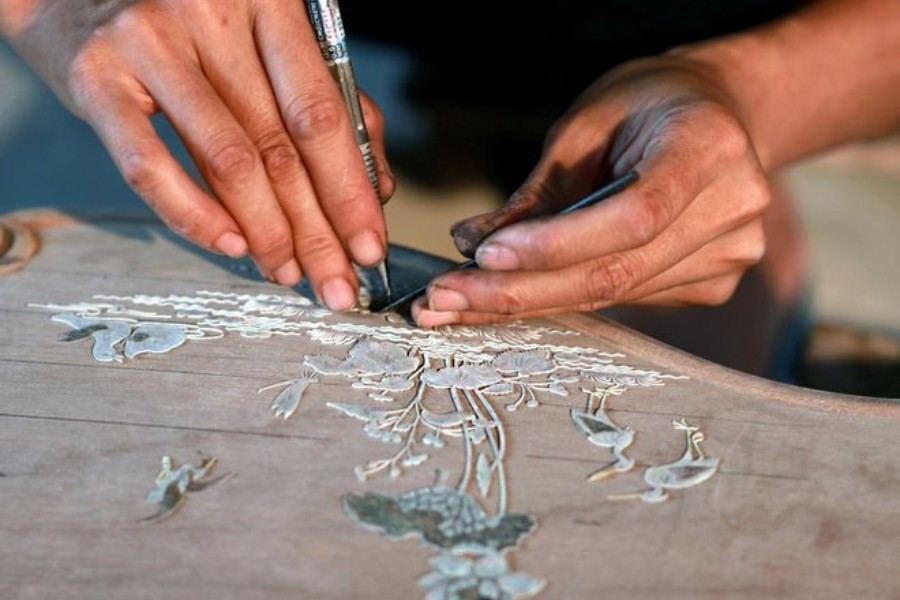 Shimmering mother-of-pearl pieces telling thousand-year stories through delicate inlay work