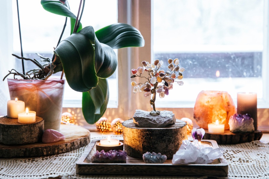 Lit scented candles in cozy spaces create relaxing atmospheres