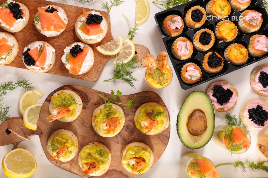 Colorful finger food tray with cute mini canapes and sandwiches