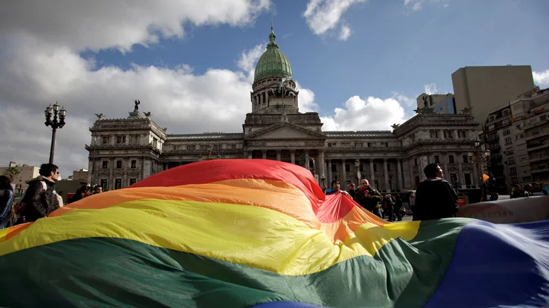 Demonstrators in Buenos Aires wave a gay pride flag Wednesday outside Argentina's Congress in support of a proposal to legalize same-sex marriage.