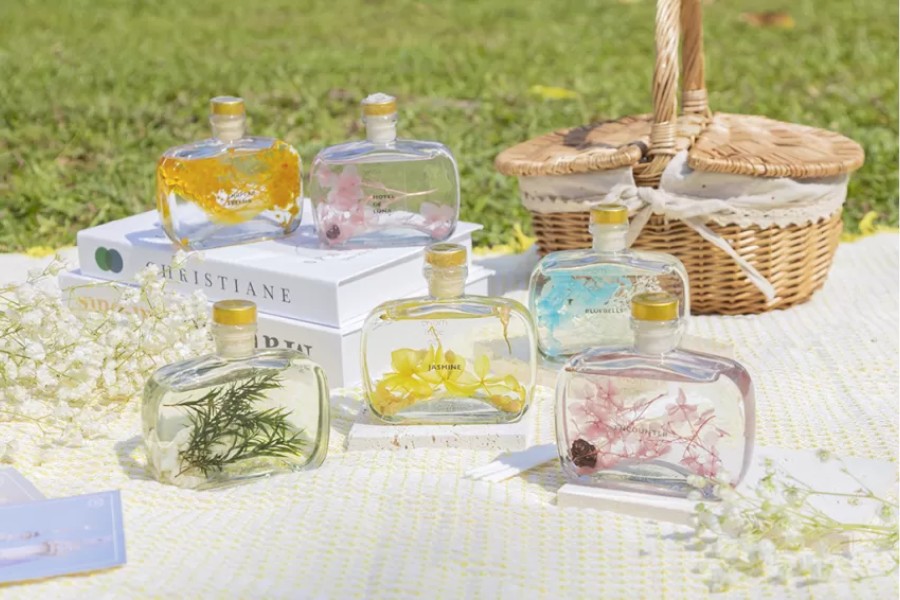 Essential oil set with delicate bottles and modern diffuser