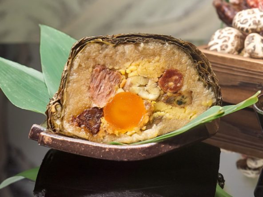 Cantonese bazhang typically takes a rectangular pillow shape - this variety's signature form. The skillful wrapping technique ensures easy cutting and beautiful presentation after cooking.