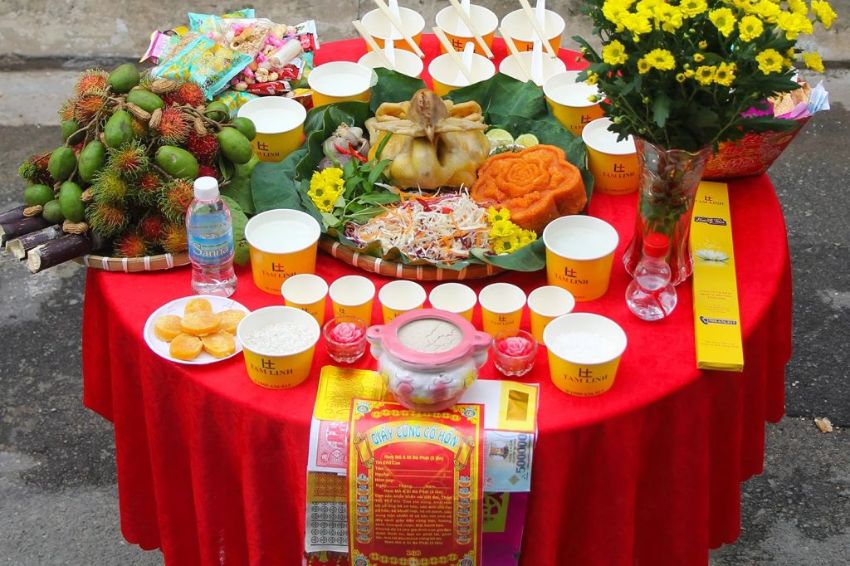 Image 02. Traditional ghost offerings with lit incense and candles