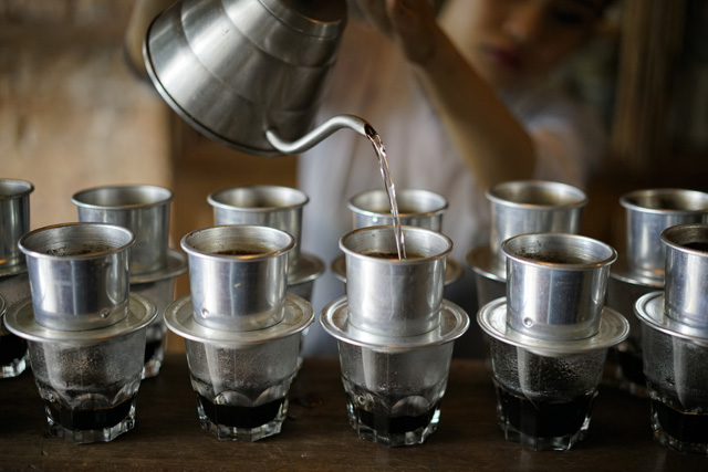 vietnamese coffee, coconut coffee, bird cafe, parked motorbikes, motorbike taxi, many shops, meeting rooms
