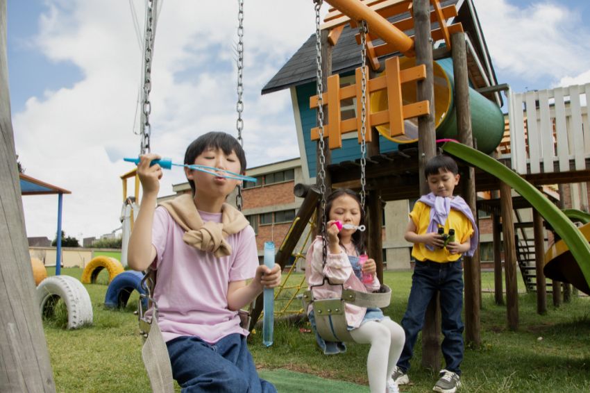 Children excitedly participate in outdoor games, having fun while staying healthy and active