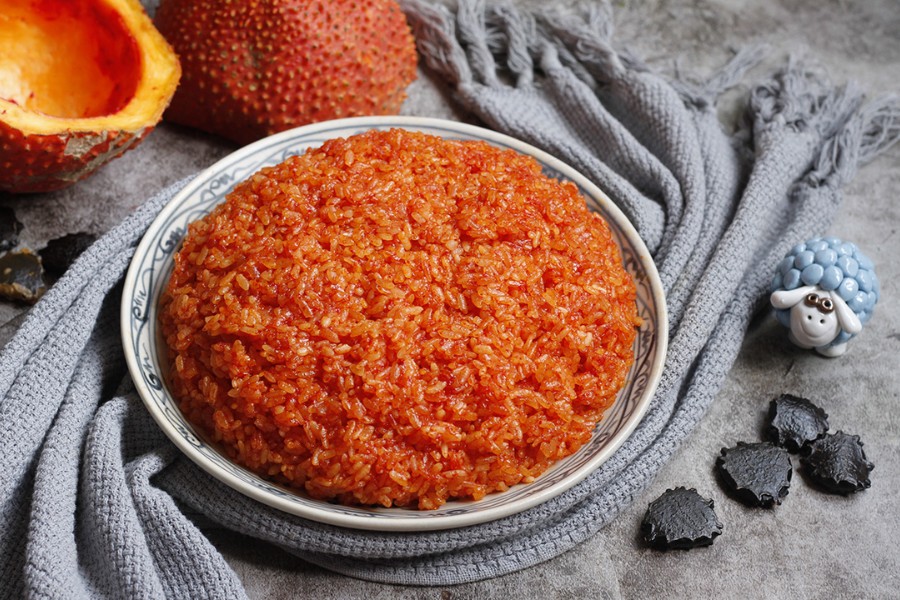 Bright red gac sticky rice - symbol of luck and success in every exam