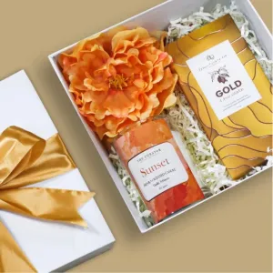 The "Happier" Gift Set brings bliss with the flavor of love, featuring a scented candle & chocolate gift box elegantly packed in a beautiful gift box - a perfect birthday gift for her or a thoughtful Women's Day gift